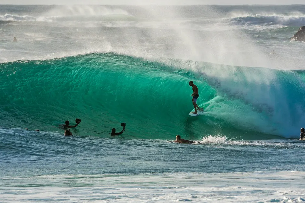 Clases de surf en playa El Buey, Arica Chile — coach certificado ISA